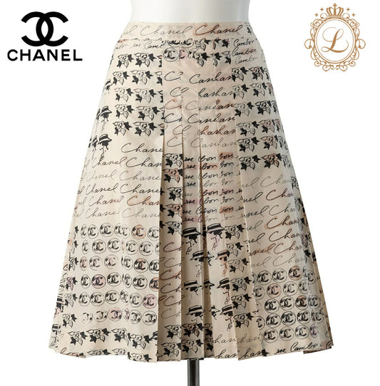 CHANEL Pleated Skirt, Coco Mark Logo, Silk, Ivory, Gold-Tone Hardware, Pre-Owned - Vintage La Charme