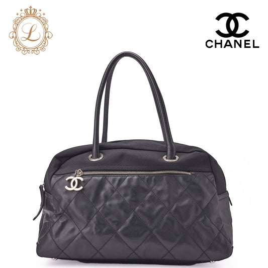 CHANEL Handbag Boston Bag Coated Canvas Coco Charm Black Silver-Tone Hardware Pre-Owned - Vintage La Charme
