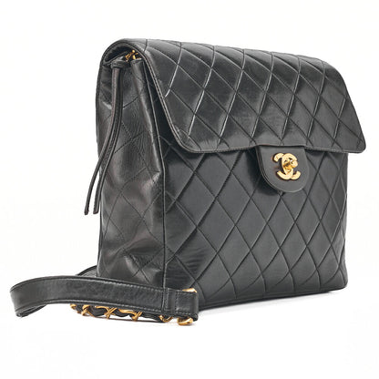 CHANEL Lambskin Matelasse Turn Lock Chain Backpack Black Gold-Tone Hardware, Pre-Owned