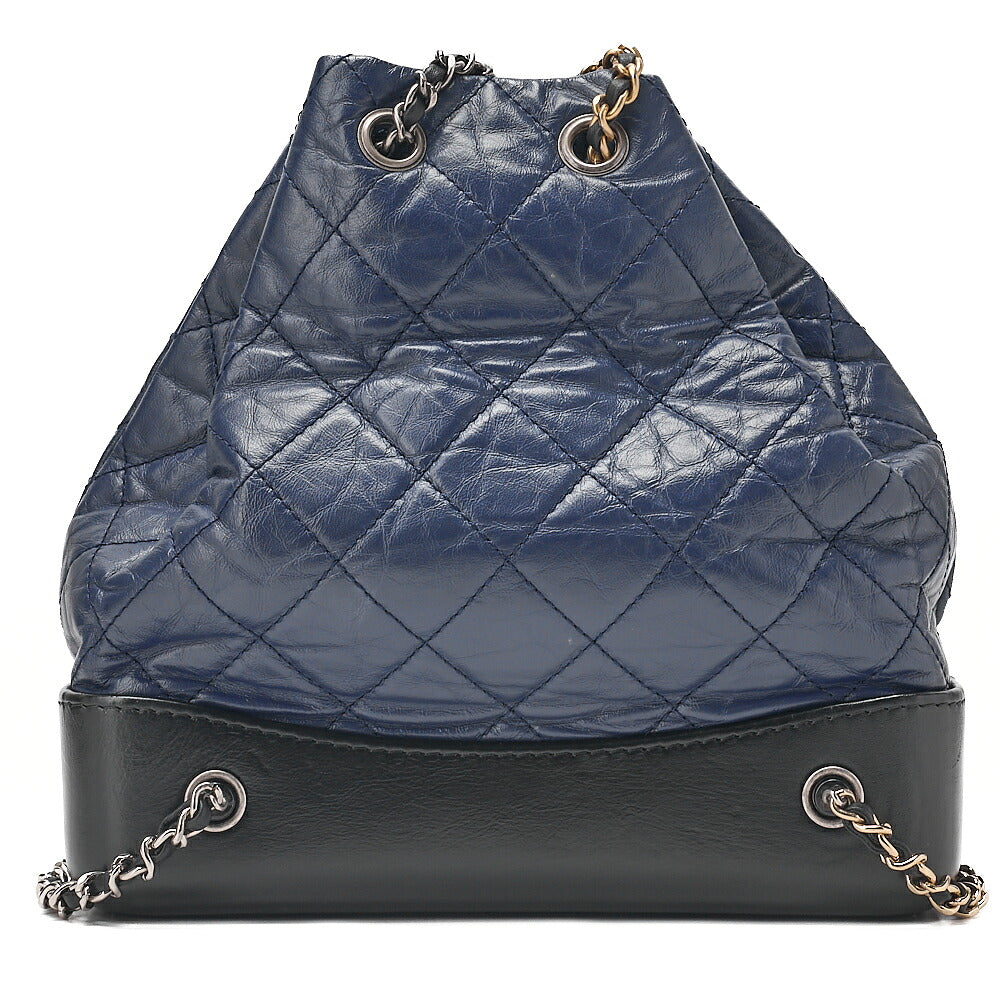 CHANEL Vintage Calf Gabrielle de Chanel Drawstring Chain Backpack Navy x Black Gold x Silver-Tone Hardware, Pre-Owned