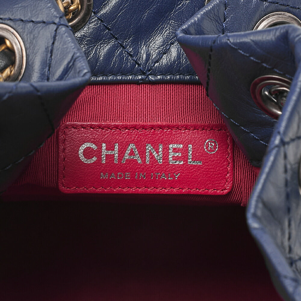 CHANEL Vintage Calf Gabrielle de Chanel Drawstring Chain Backpack Navy x Black Gold x Silver-Tone Hardware, Pre-Owned