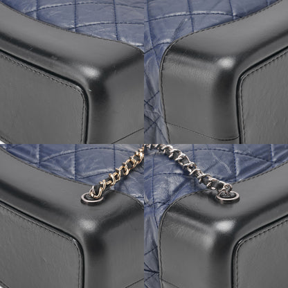 CHANEL Vintage Calf Gabrielle de Chanel Drawstring Chain Backpack Navy x Black Gold x Silver-Tone Hardware, Pre-Owned