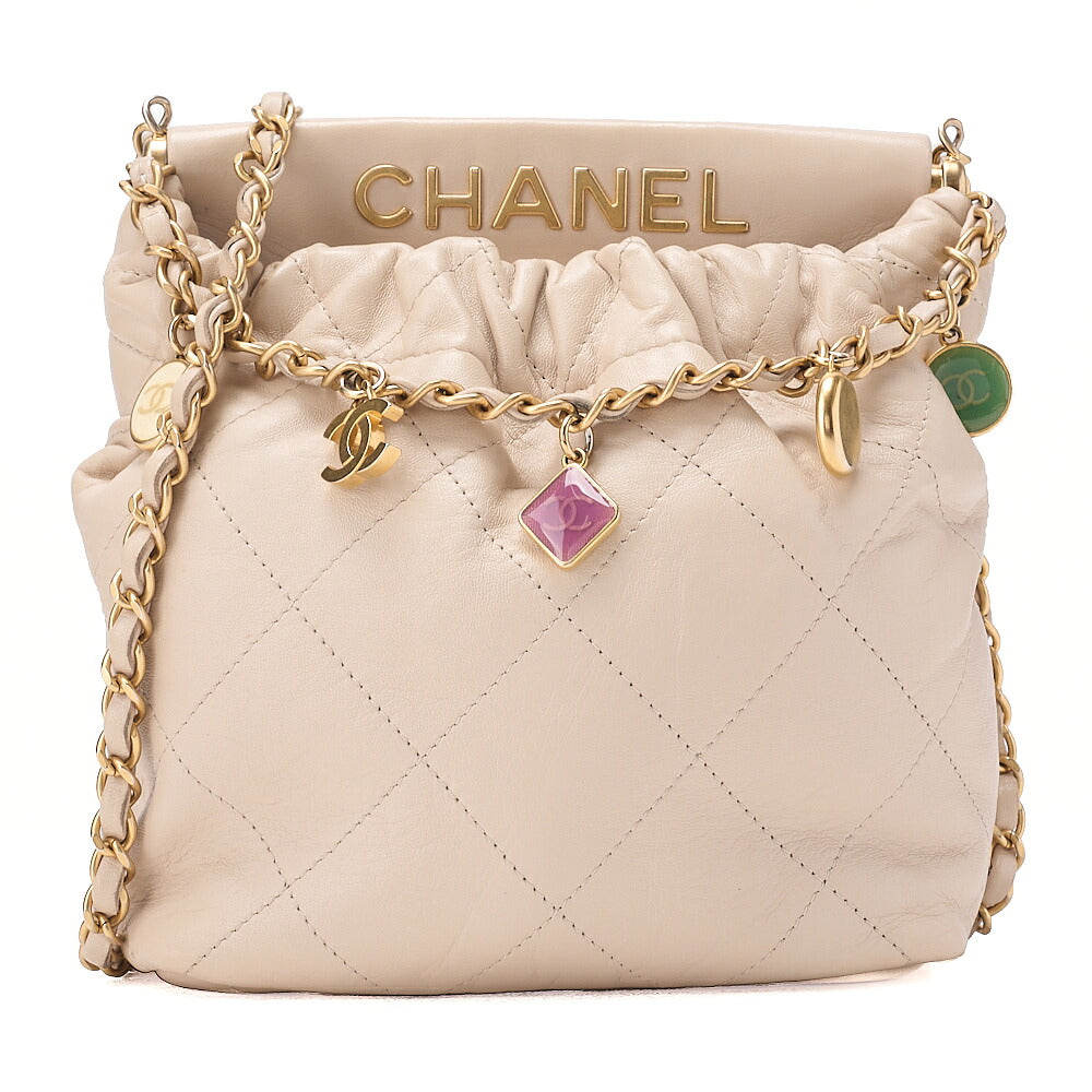 CHANEL Lambskin Matelasse with charm, drawstring style, chain shoulder, beige Gold-Tone Hardware, Pre-Owned