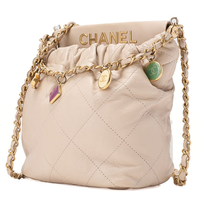 CHANEL Lambskin Matelasse with charm, drawstring style, chain shoulder, beige Gold-Tone Hardware, Pre-Owned