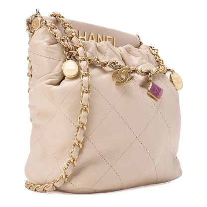 CHANEL Lambskin Matelasse with charm, drawstring style, chain shoulder, beige Gold-Tone Hardware, Pre-Owned