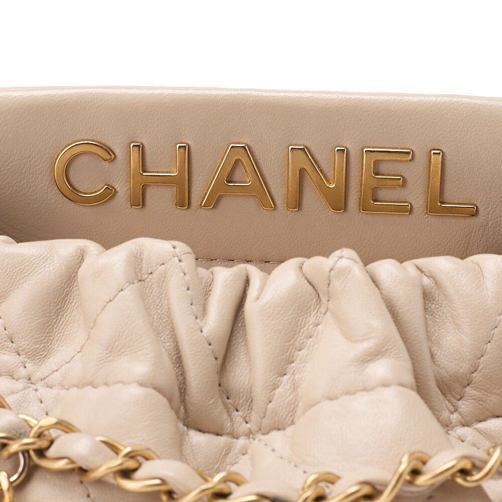 CHANEL Lambskin Matelasse with charm, drawstring style, chain shoulder, beige Gold-Tone Hardware, Pre-Owned