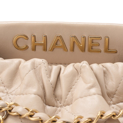 CHANEL Lambskin Matelasse with charm, drawstring style, chain shoulder, beige Gold-Tone Hardware, Pre-Owned