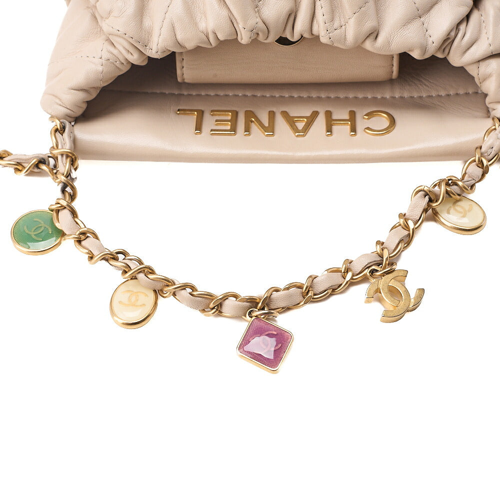 CHANEL Lambskin Matelasse with charm, drawstring style, chain shoulder, beige Gold-Tone Hardware, Pre-Owned