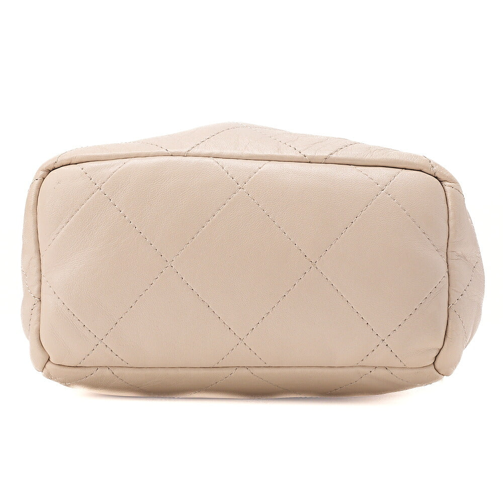 CHANEL Lambskin Matelasse with charm, drawstring style, chain shoulder, beige Gold-Tone Hardware, Pre-Owned