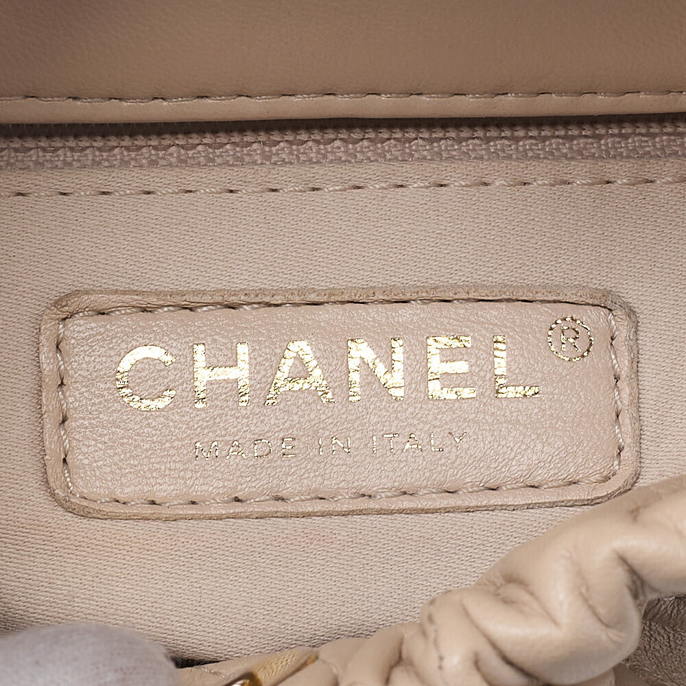 CHANEL Lambskin Matelasse with charm, drawstring style, chain shoulder, beige Gold-Tone Hardware, Pre-Owned