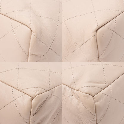 CHANEL Lambskin Matelasse with charm, drawstring style, chain shoulder, beige Gold-Tone Hardware, Pre-Owned
