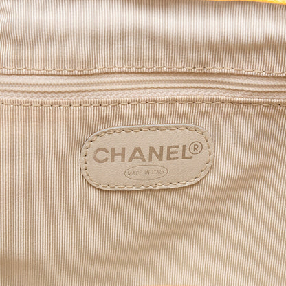CHANEL Chanel Caviar Skin Drawstring Matelasse Chain Backpack with Plate Charm Yellow Silver-Tone Hardware, Pre-Owned